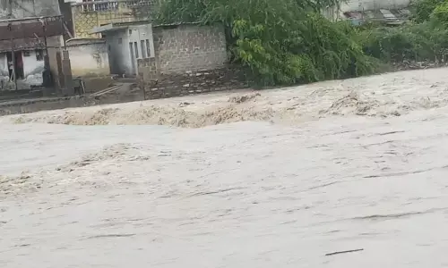 Floodwater entering into residential areas at Jammi Chettu area in Joharapuram village