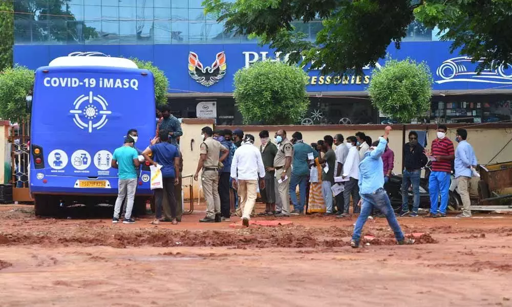 People stand in queue line at the IGMC stadium for Covid test in Vijayawada (File photo)