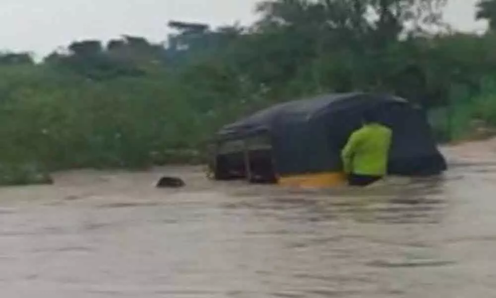 Woman dies after auto sweeps away in water in Telanganas Nalgonda