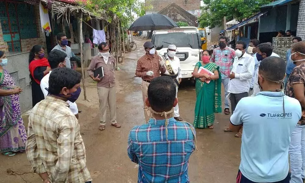 Tekkali RDO I Kishore sensitising people on Covid pandemic at Nuvvalarevu village in the wake of report of Covid positive cases (file photo)