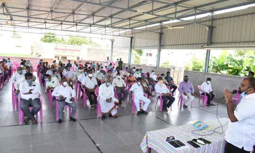 MLA Bhupal Reddy addressing the merchants at a meeting held at his camp office in Nalgonda on Monday