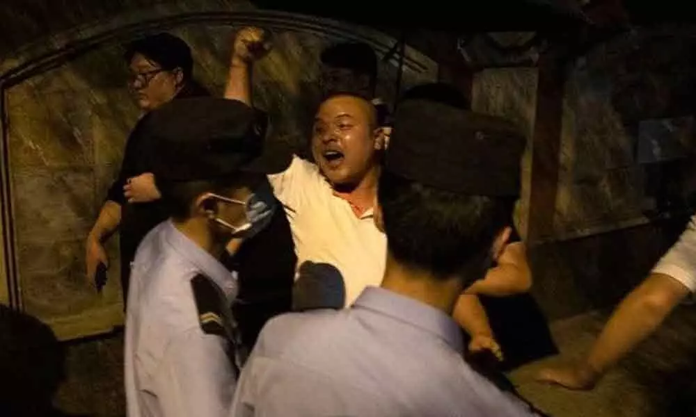 A Chinese man shouts pro-China slogans outside the United States Consulate in Chengdu in southwest Chinas Sichuan province.