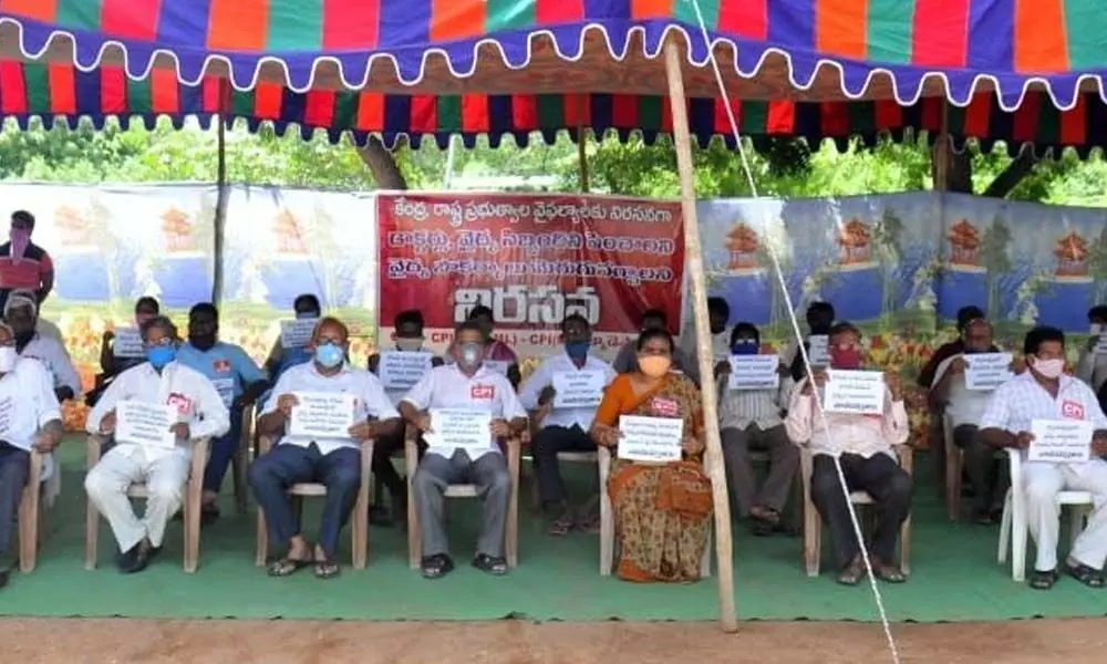 Leaders from various Left parties staging a protest at Sundaraiah Bhavan in Ongole on Monday