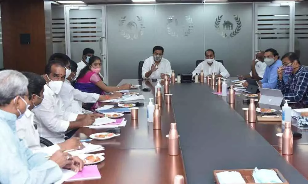 Ministers KT Rama Rao and A Indrakaran Reddy reviewing on the municipalities in Adilabad on Tuesday
