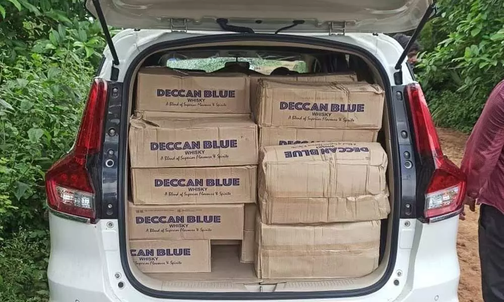 Liquor boxes in the dickey of seized car