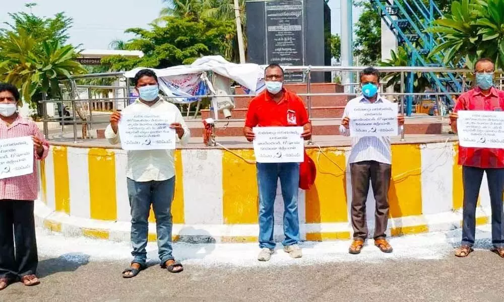 KVPS leaders staging a protest at Gokavaram bus station in Rajamahendravaram on Tuesday