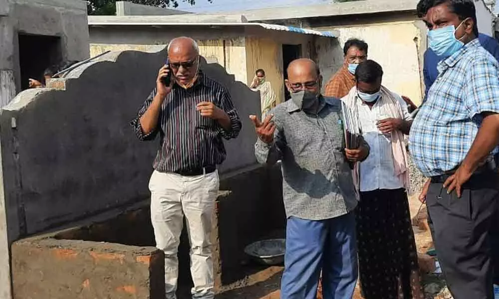 School Education State Commissioner V China Veerabadrudu (right) inspecting works at the primary school at Naira in Srikakulam rural mandal on Tuesday