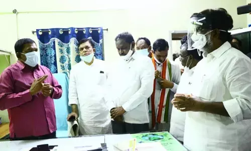 CLP leader Bhatti discussing Congress party office building issue with municipal officials in Manuguru on Wednesday