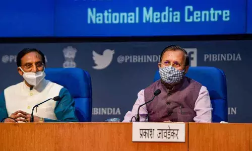Union Ministers Prakash Javadekar and Ramesh Pokhriyal Nishank (L)  during a press conference, at NMC in New Delhi on Wednesday