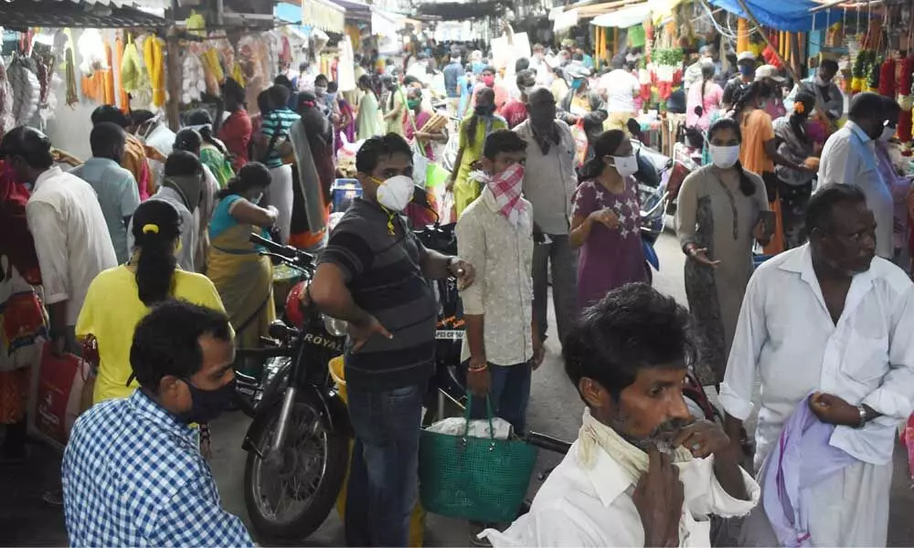 Physical distancing goes for a toss as the citizens throng markets for Varalakshmi Vratham shopping