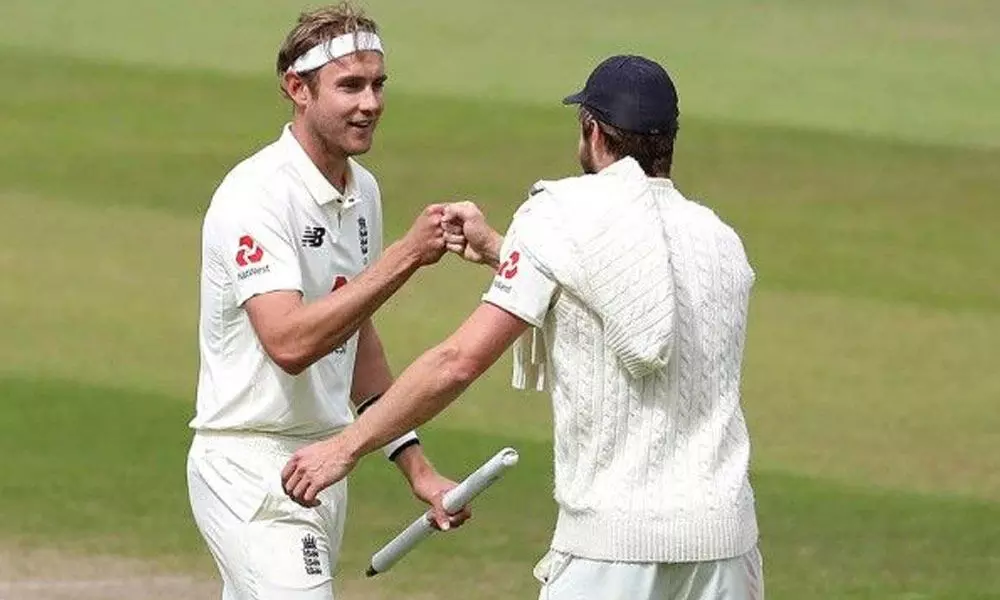 Englands Stuart Broad(left) and Chris Woakes celebrate their win on the fifth day of the third cricket Test match between England and West Indies at Old Trafford in Manchester, England