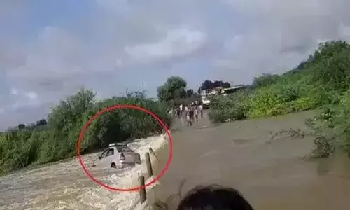 Car washes away in flood water in Anantapur, no casualties reported