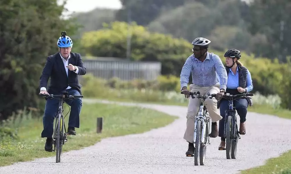 UK Prime Minister Boris Johnson seen riding a Made In India Viking Pro bike.