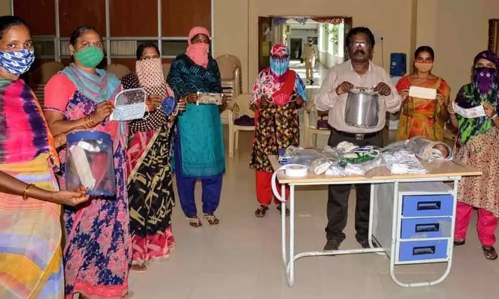 SHG mandal level members showing various masks prepared by them during the training