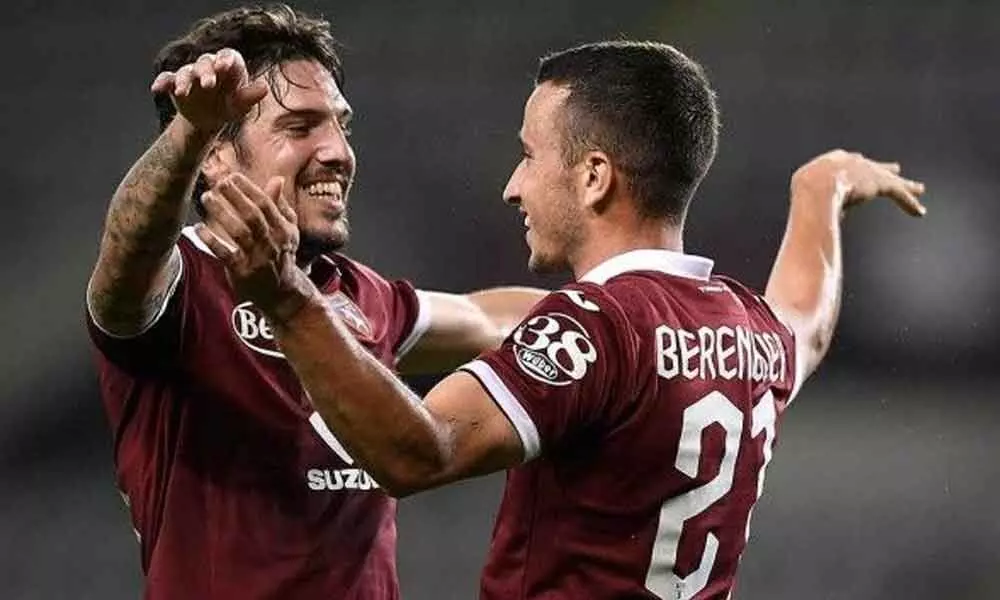 Torinos Alejandro Berenguer (right) celebrates after scoring during a SerieA soccer match between Torino and Roma, at the Grande Torino stadium in Turin, Italy