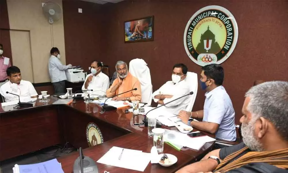 Minister for Panchayat Raj Peddi Reddy Ramachandra Reddy and Deputy Chief Minister K Narayana Swamy conducting a meeting with district officers at Municipal Office in Tirupati on Friday