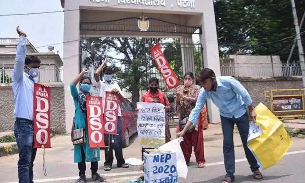 All India Democratic Students Organisation activists burn copies of the new National Education Policy 2020 during a protest outside Patna University, in Patna