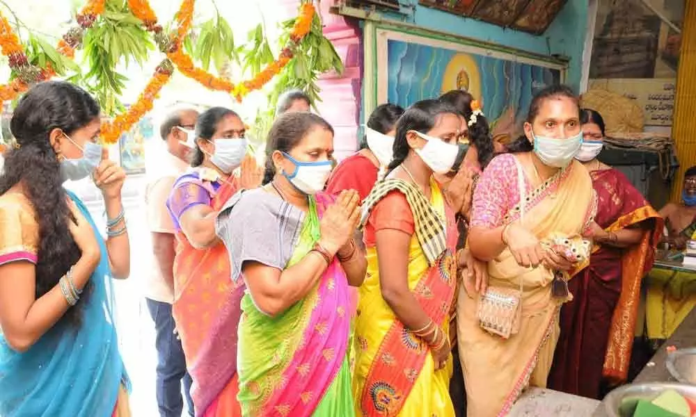 Women visiting Astalakshmi temple at Arundalpet in Guntur on Friday on the occasion of Varalakshmi Vratam