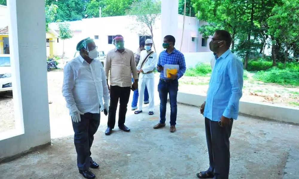 Collector S Venkat Rao inspects construction works at MLA’s camp office