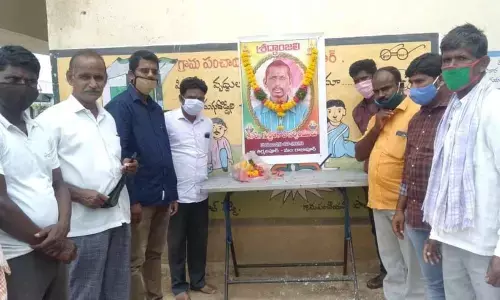 CPI leaders paying tributes to Narasimhulu, who was allegedly killed by sand mafia, in Tirumalapur village on Monday