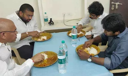 Minister CSVG Krishna, MP Bharat, MLA Raja and Collector Muralidhar Reddy tasting food made for corona patients at Bommur Covid centre on Monday