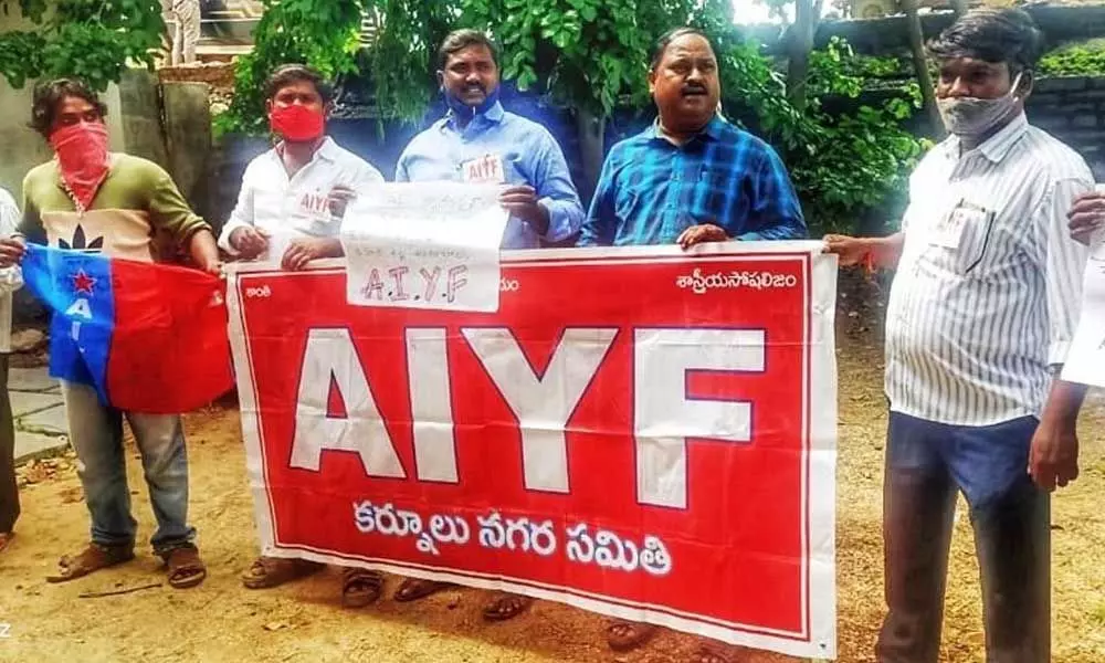 AIYF leaders staging a protest demanding supply of medicines and nutritious food kits to home quarantine patients