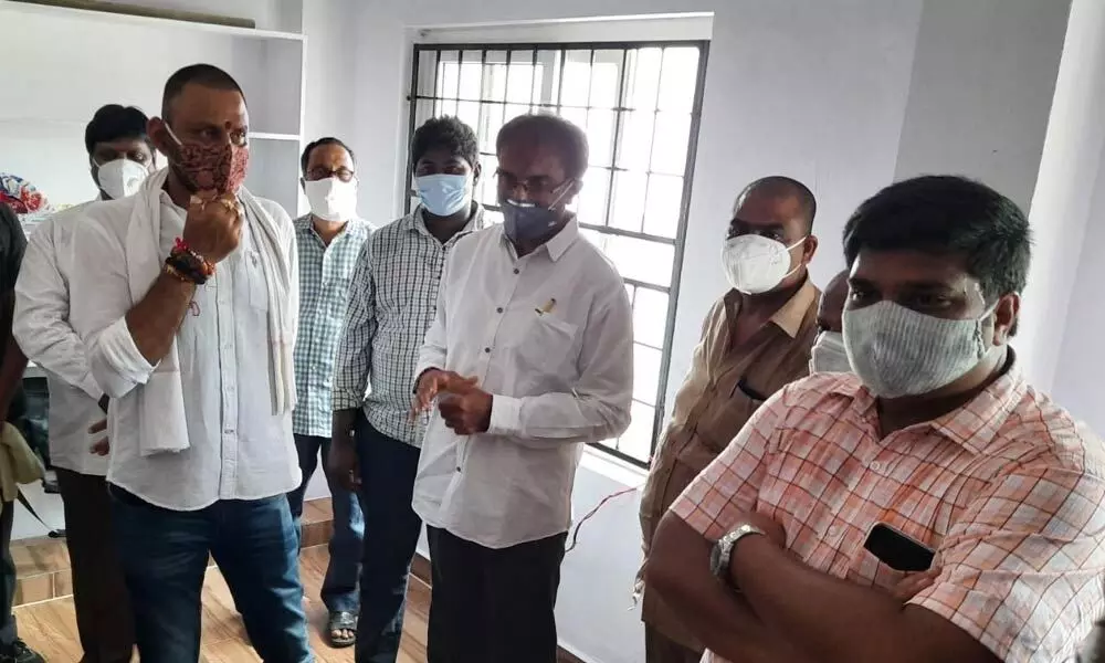 Minister for Civil Supplies Kodali Nani with the villagers at the village secretariat office after the inauguration at Dondapadu village of Gudivada rural mandal on Monday