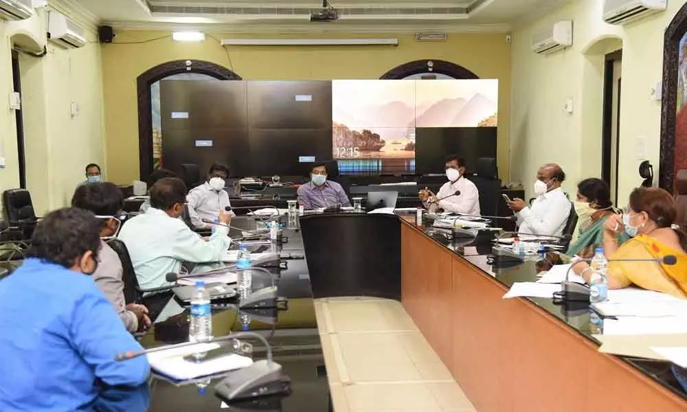 Guntur district special officer for Covid-19 B Rajasekhar addressing the officials in the Collectorate in Guntur city on Monday. District Collector I Samuel Anand Kumar and Joint Collector A S Dinesh Kumar are also seen.