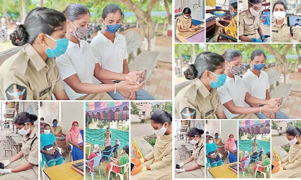 Police Department women staff watching Raksha Bandhan programme on smart phones in Machilipatnam on Tuesday