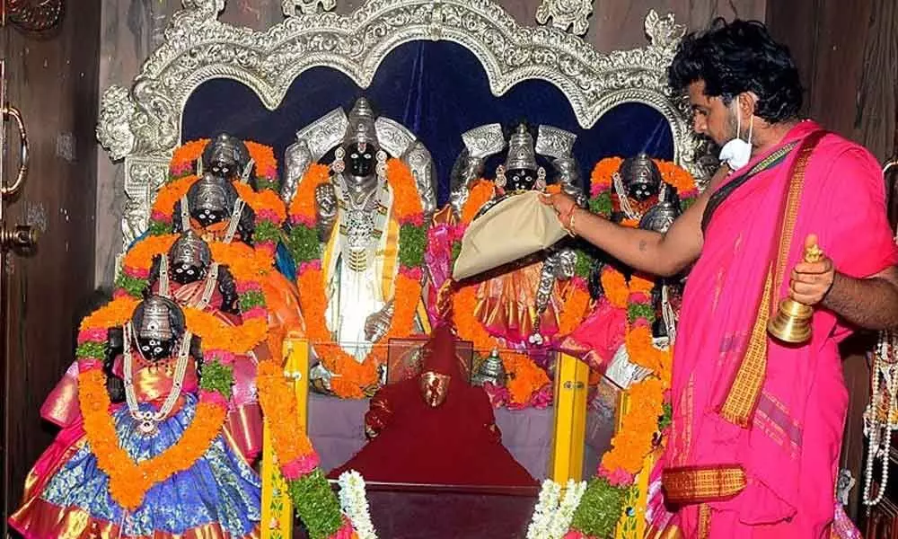 A priest performing special puja at Asta Lakshmi temple in Guntur on the occasion of Sravana Mangalavaram