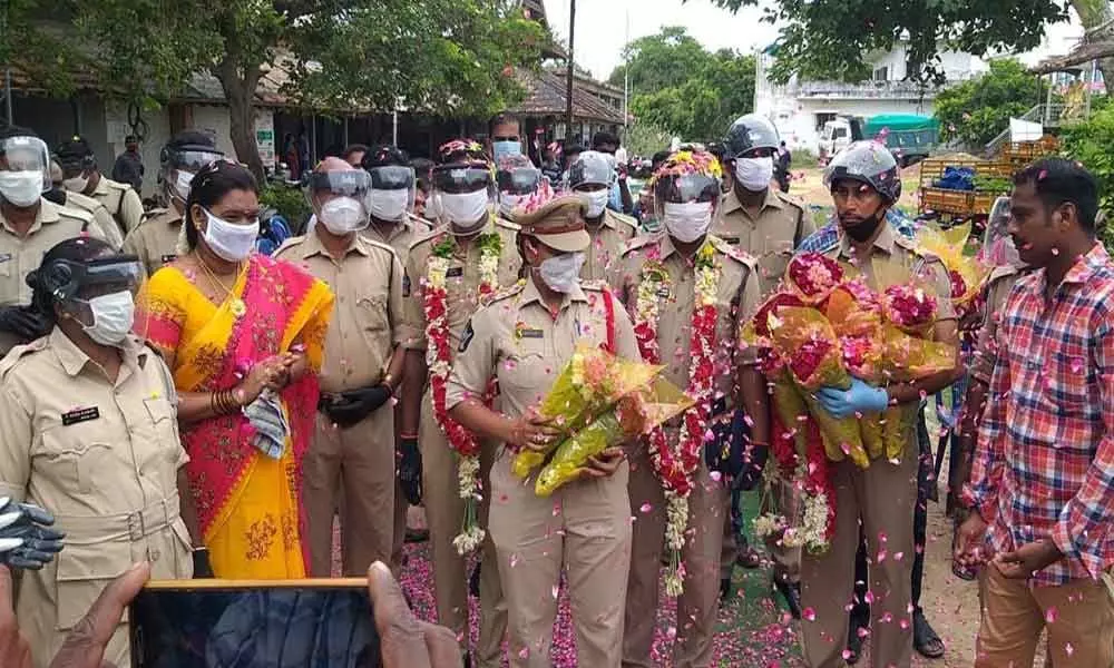 Covid recovered police personnel receiving warm welcome in Kaikalur on Tuesday