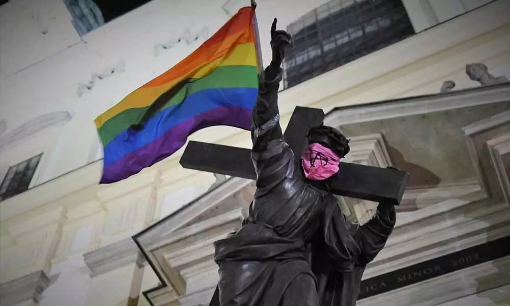 3 charged over LGBT flags on Warsaw statues
