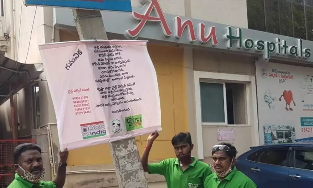 Childline staff arrange a flexi near Anu Hospitals in Vijayawada on Thursday