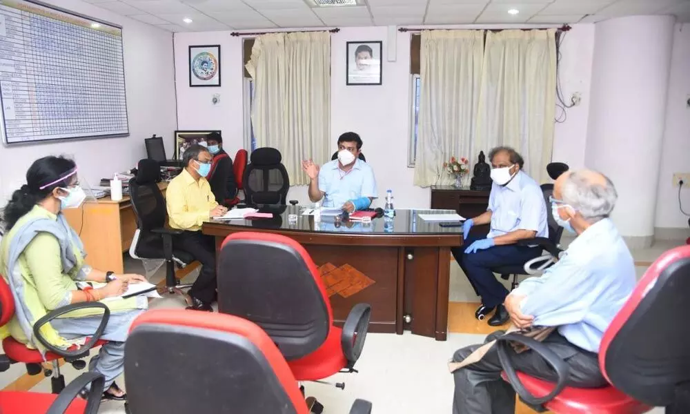 District Collector V Vinay Chand conducting a review meeting with the VIMS hospital management in Visakhapatnam on Thursday