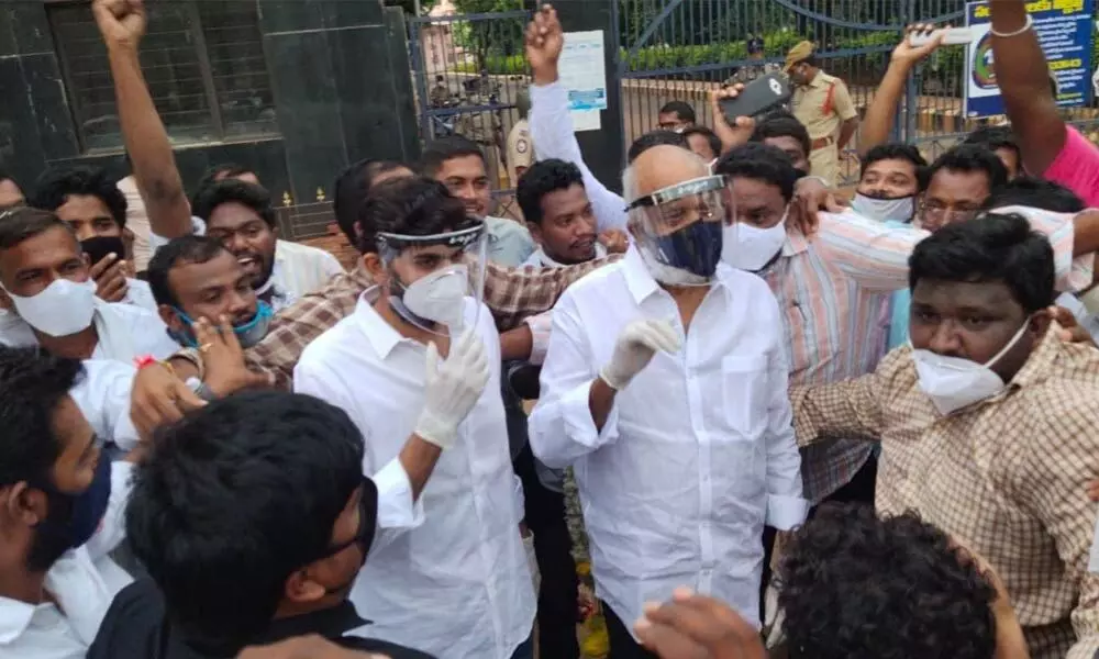 Supporters of JC family greet JC Prabhakar Reddy and his son