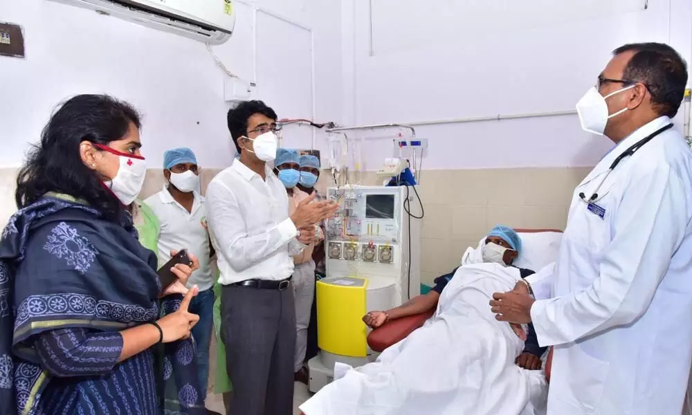 District Collector D Muralidhar Reddy congratulating plasma donor K Appala Raju