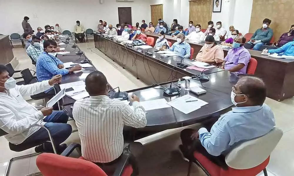 Krishna District Collector Md Imtiaz holding a meeting with officials and representatives of private hospitals at his camp office in Vijayawada on Saturday
