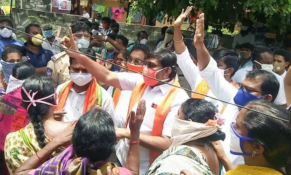 BJP leaders along with the Gollapadu residents at their protest programme in Khammam on Saturday