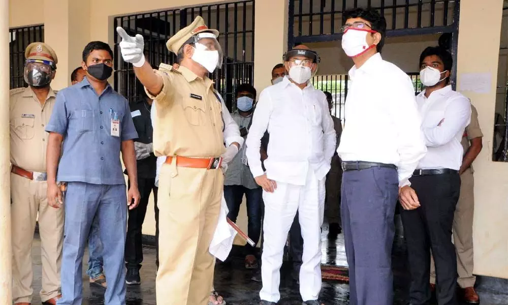 Minister for BC Welfare Cheluboyina Srinivasa Venu Gopala Krishna and Collector D M Reddy speaking with prison officials