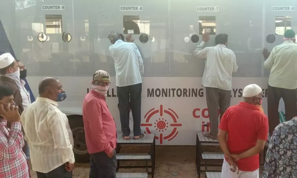 Citizens undergoing Covid test at mobile testing van in Hyderabad on Monday