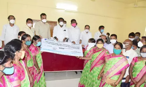 Transport Minister P Ajay distributing Covid-19 loans to women groups in Khammam on Tuesday