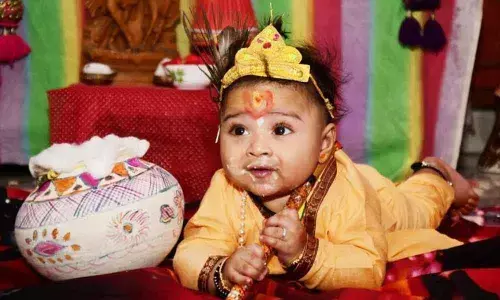 A child dressed like Lord Krishna on the occasion of Sri Krishna Janmashtami celebrations in Visakhapatnam on Tuesday. 	Photo: A  Pydiraju