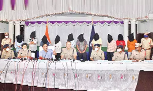 Commissioner of SEB Vineet Brijlal and SP Siddharth Kaushal with SIT team explaining about the case with the accused behind them in Ongole on Tuesday