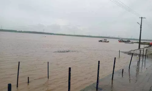 Godavari water reaching the bathing steps at Bhadrachalam on Wednesday