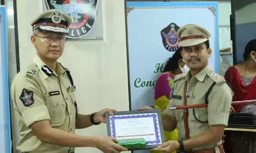 Eluru DSP O Dilip Kumar receiving award from DGP Gautam Sawang on Wednesday