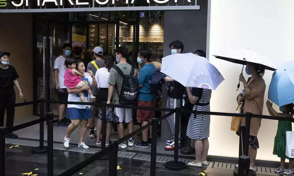 Shake Shack shrugs off trade war, opens outlet in Beijing