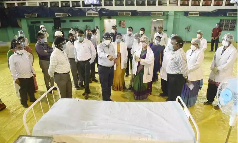 Chairman of Visakhapatnam Port Trust K Rama Mohana Rao and other officials at the Covid care centre at Rajiv Gandhi Indoor Stadium in Visakhapatnam