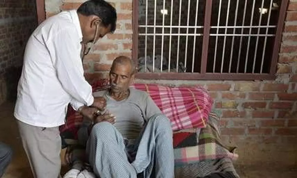 A quack treating patient at his home