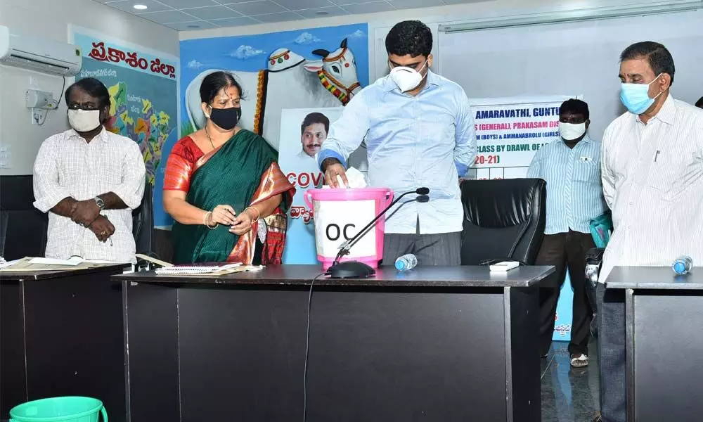 Prakasam Joint Collector TS Chetan drawing lottery for admissions in residential schools in Ongole on Thursday