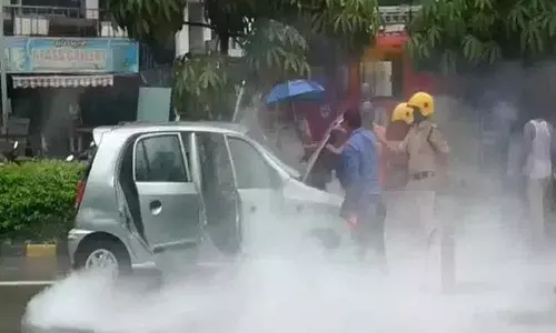 Car catches fire on a National Highway in Visakhapatnam